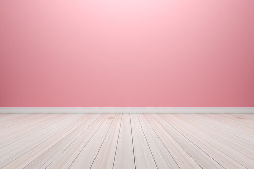 Wooden and light pink walls